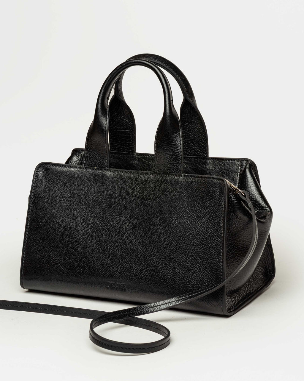 Cartera de mano Mila en cuero liso